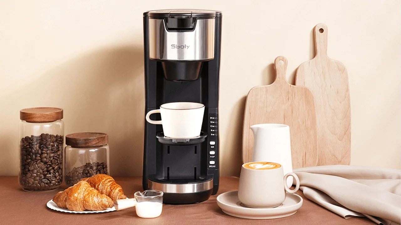 blue bowl of black bean beef tortilla soup on a board with cilantro and shredded cheese in background